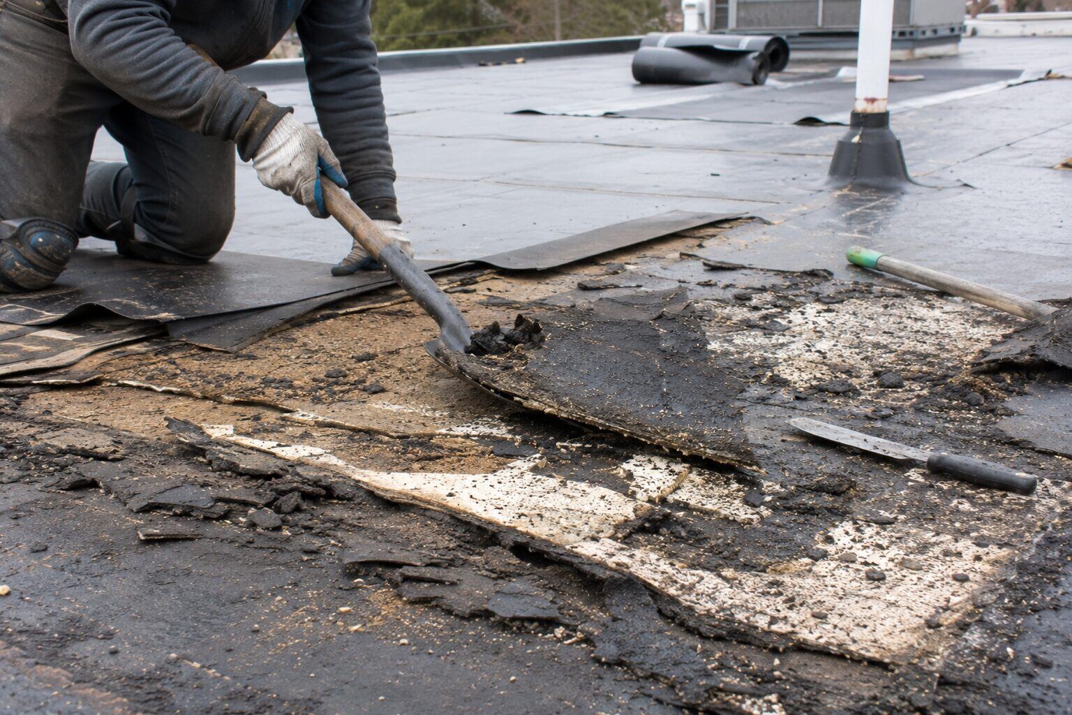 Close-up of commercial roof tear-off down to the decking