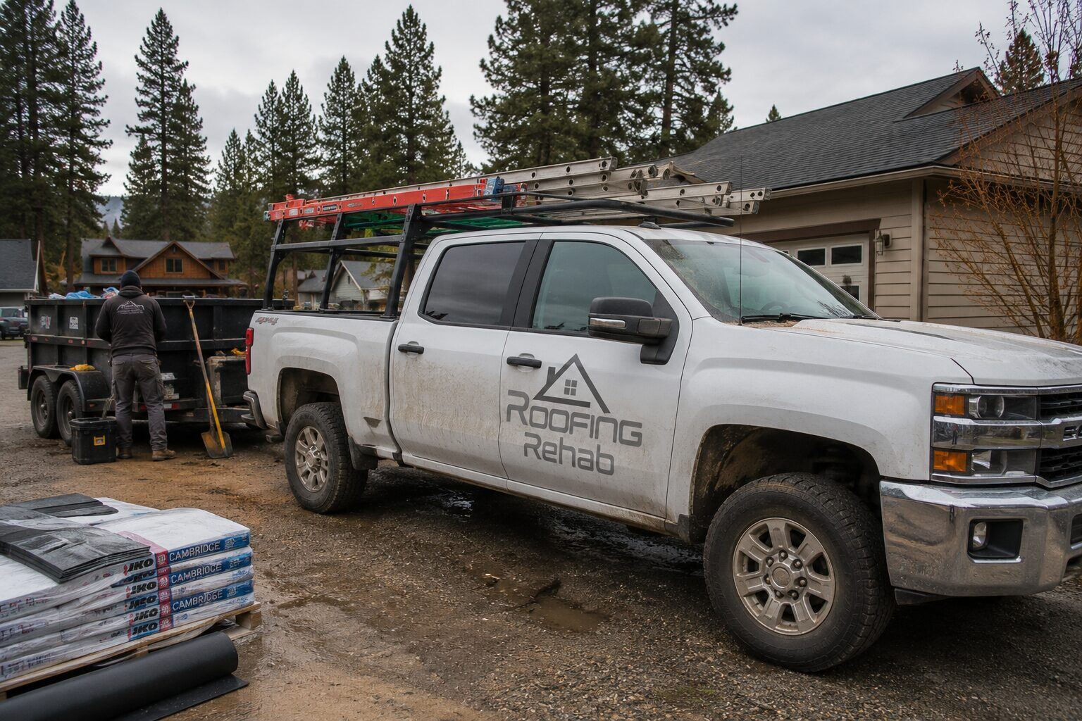 Roofing Rehab branded work truck on a job site
