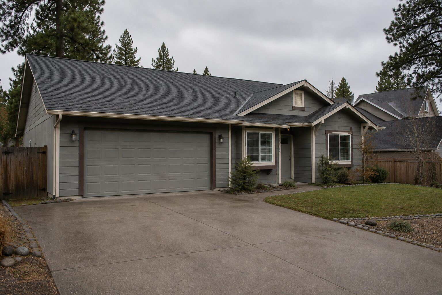 Same North Idaho home after roof replacement with new asphalt shingle roof