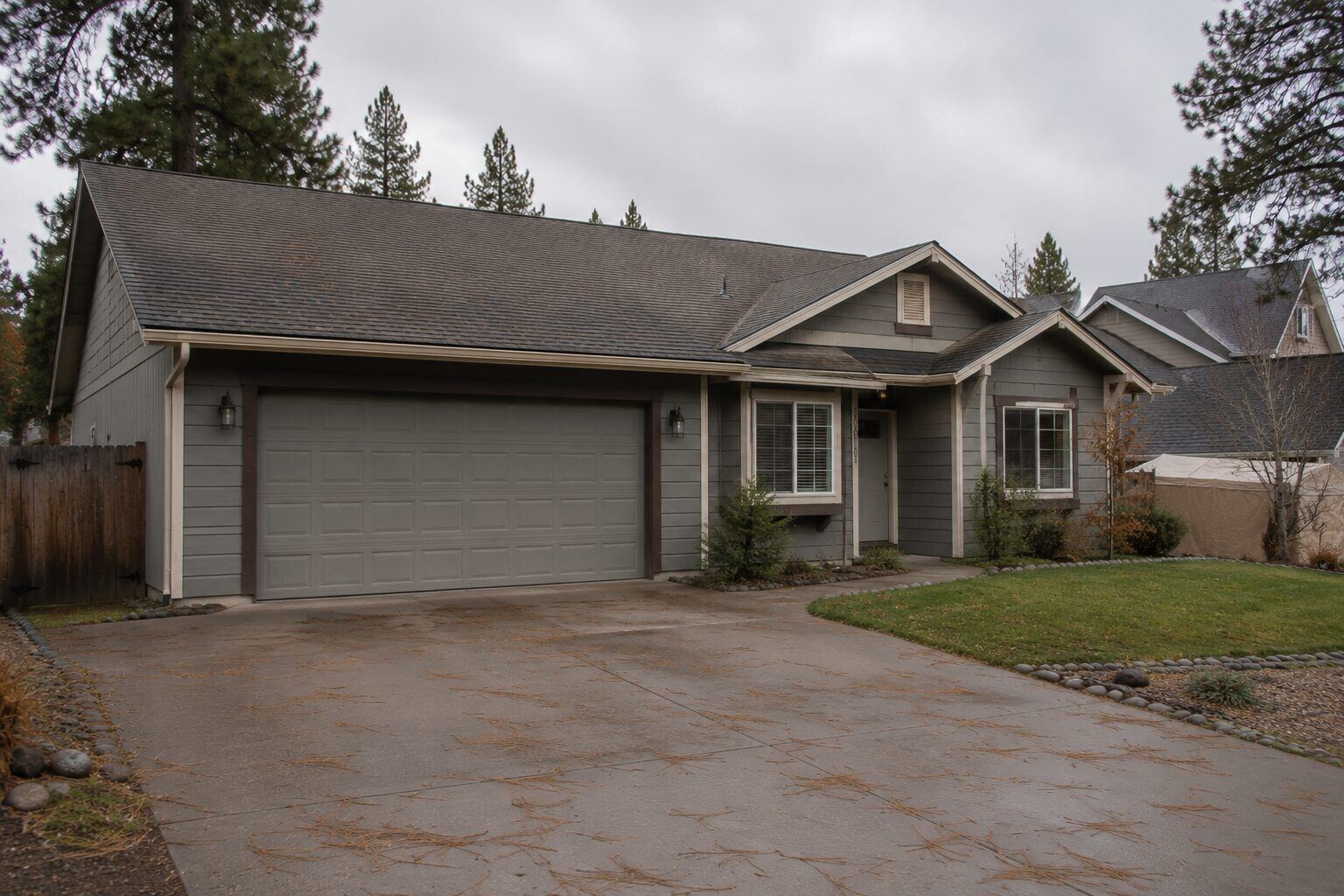 Home in North Idaho before roof replacement, showing the aged asphalt shingle roof